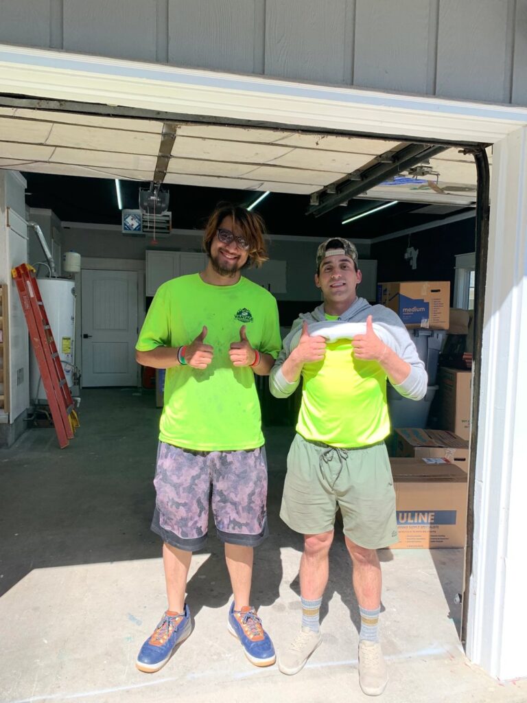 Two Vantage movers giving a thumbs up